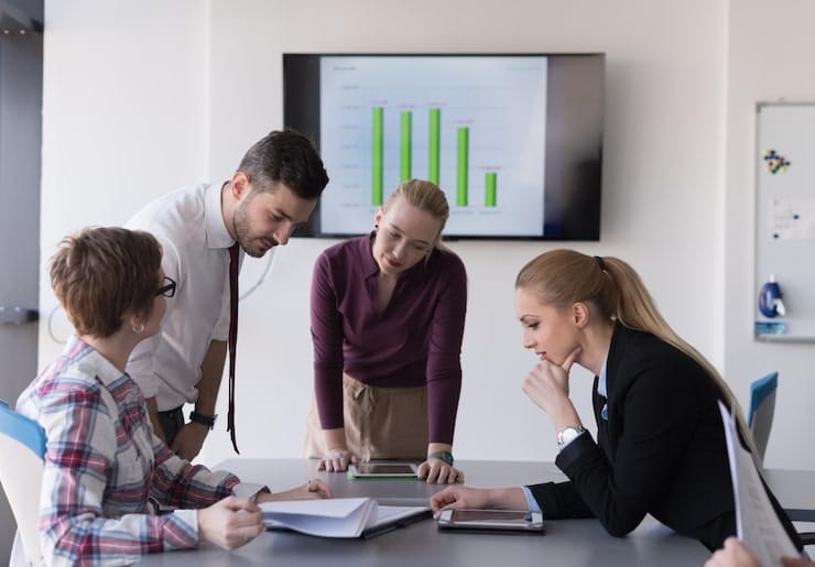 Business team analyzing customer feedback trends and reputation insights