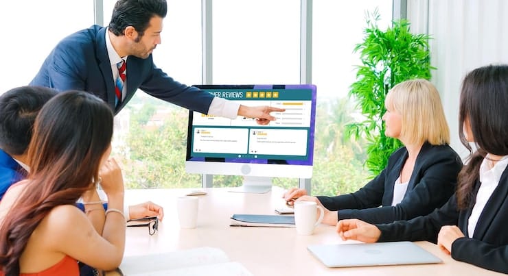 Business team monitoring customer reviews and online reputation activity